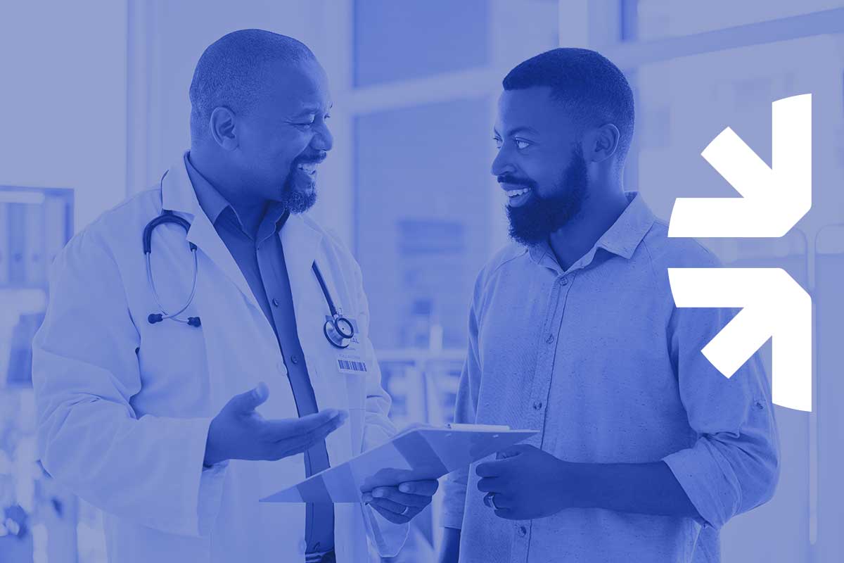 Summit Health Oregon smiling male doctor talking to a smiling male patient